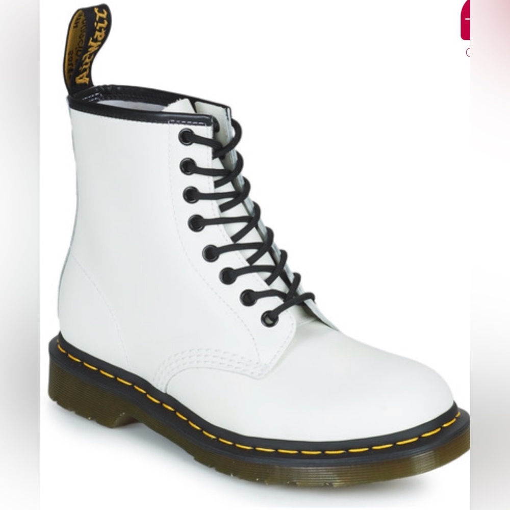 White lace up Dr Marten boots.